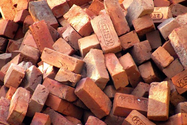 A pile of red clay bricks