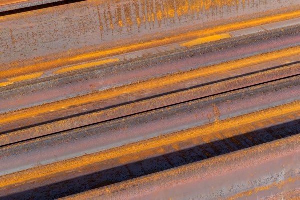 Steel I-beams stacked side by side