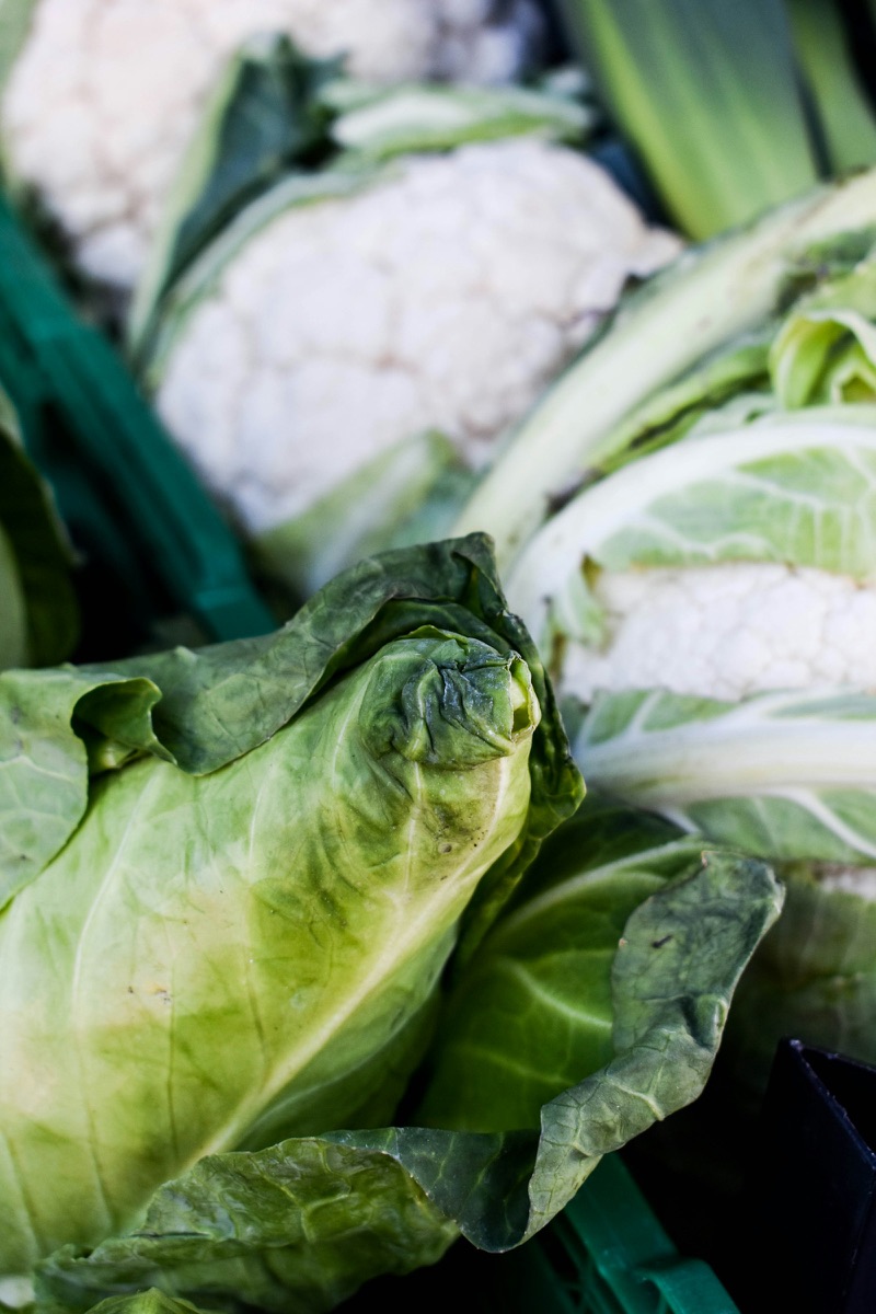 Cauliflowers and spring greens in crates